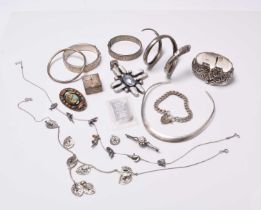 A collection of various pieces of silver and white metal jewellery