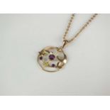 An early 20th century purple paste set pendant on chain