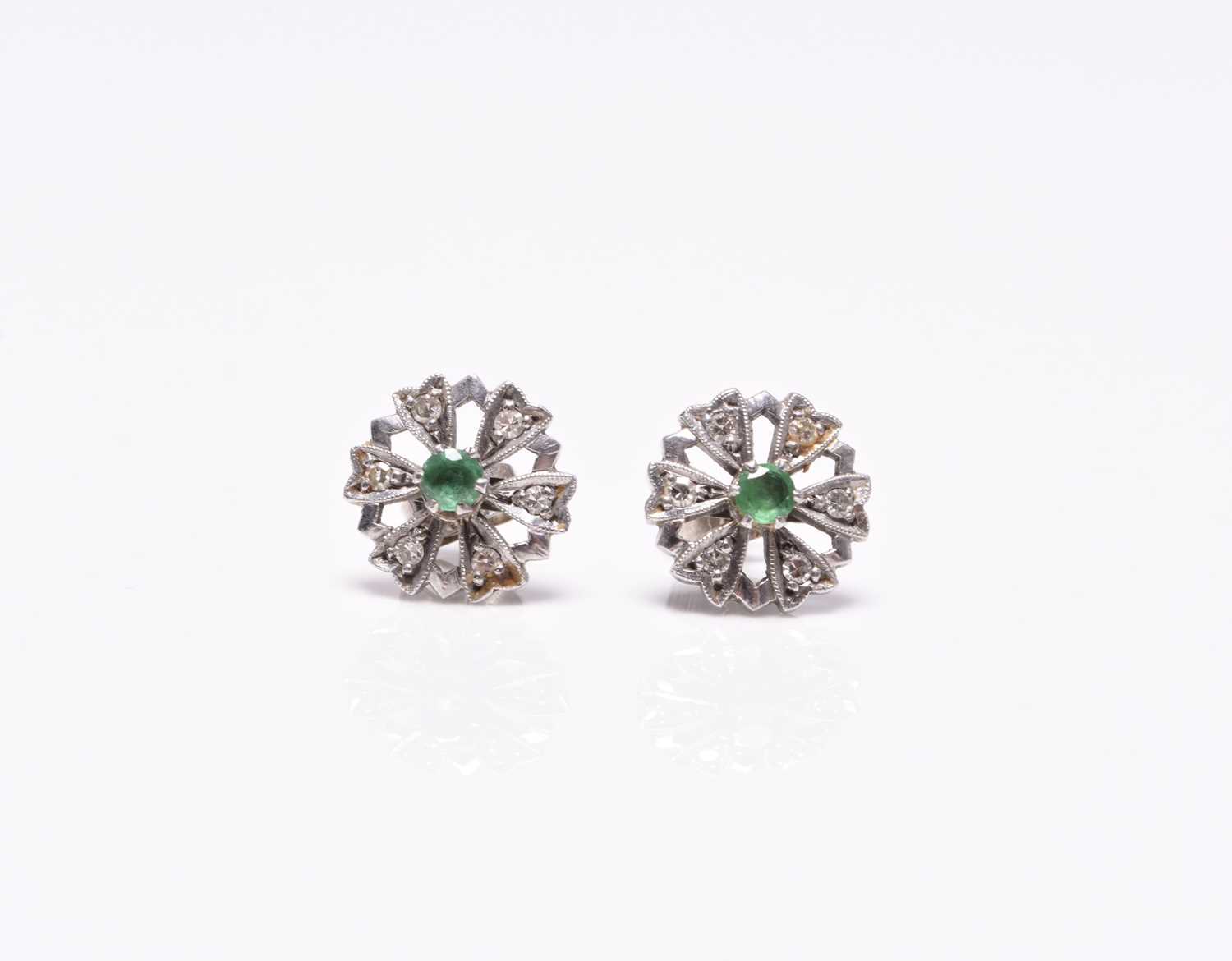 A pair of emerald and diamond floral cluster earrings