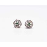 A pair of emerald and diamond floral cluster earrings