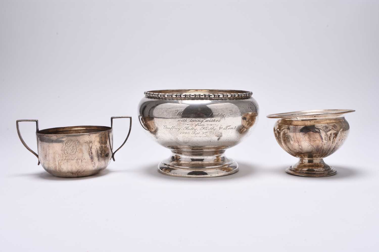 Three silver bowls