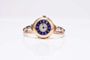 A lady's 18ct gold and enamel watch on 9ct bracelet