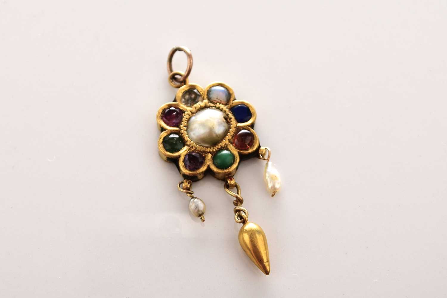 A yellow metal, enamel and stone set cluster pendant