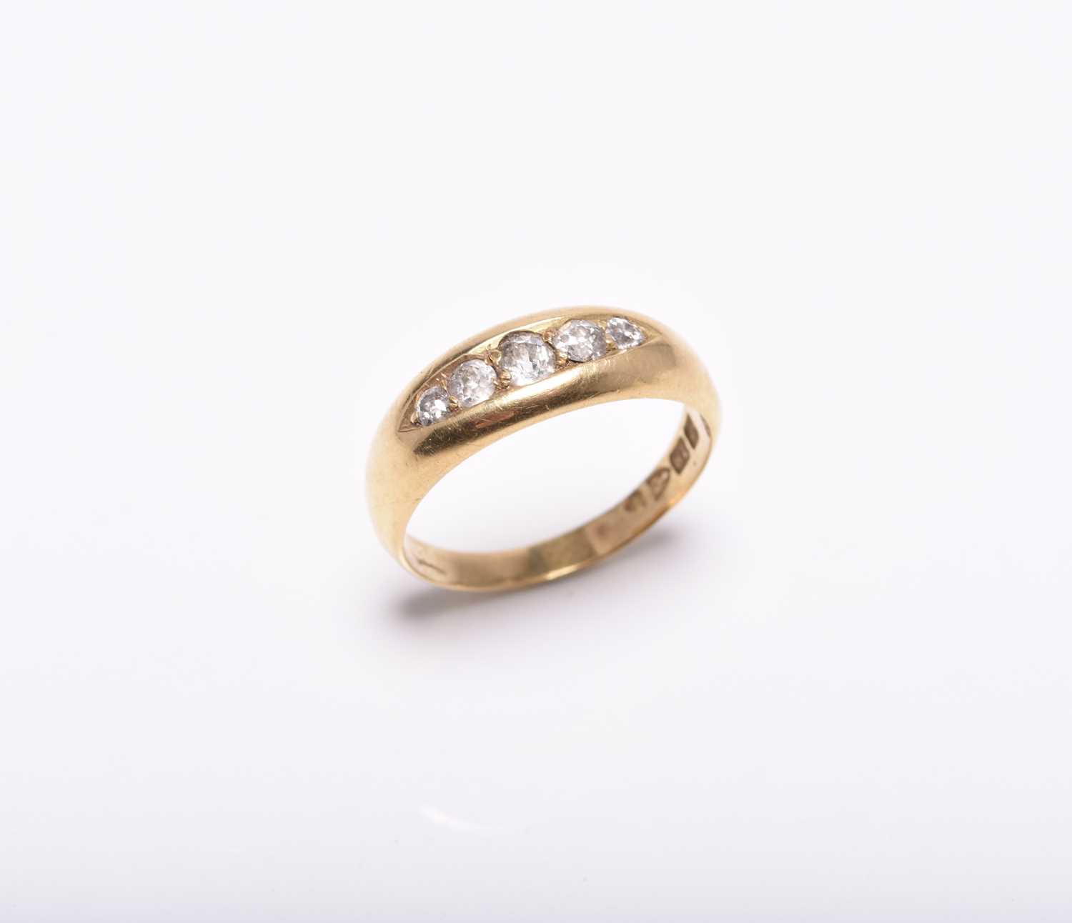 An 18ct gold graduated five stone diamond ring