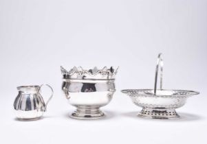 A silver basket, cream jug and bowl