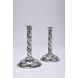 A pair of Victorian silver tapersticks