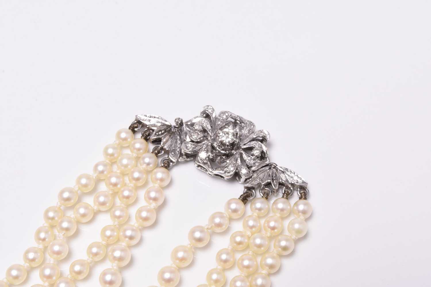 A four strand graduated cultured pearl necklace with 18ct white gold diamond set clasp - Image 2 of 16