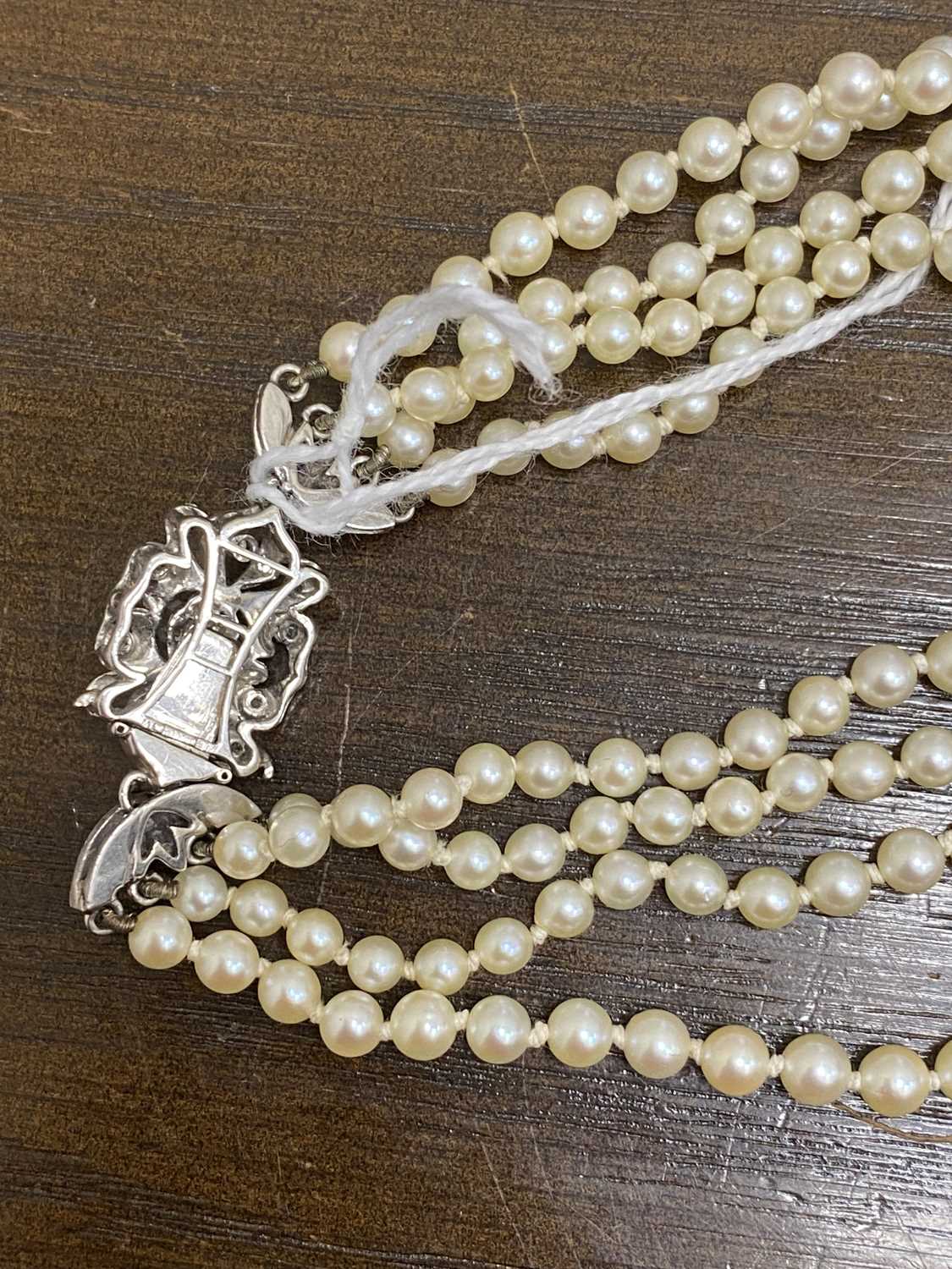 A four strand graduated cultured pearl necklace with 18ct white gold diamond set clasp - Image 4 of 16