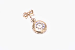 A lady's 15ct gold enamelled half hunter fob watch with 9ct gold brooch bow