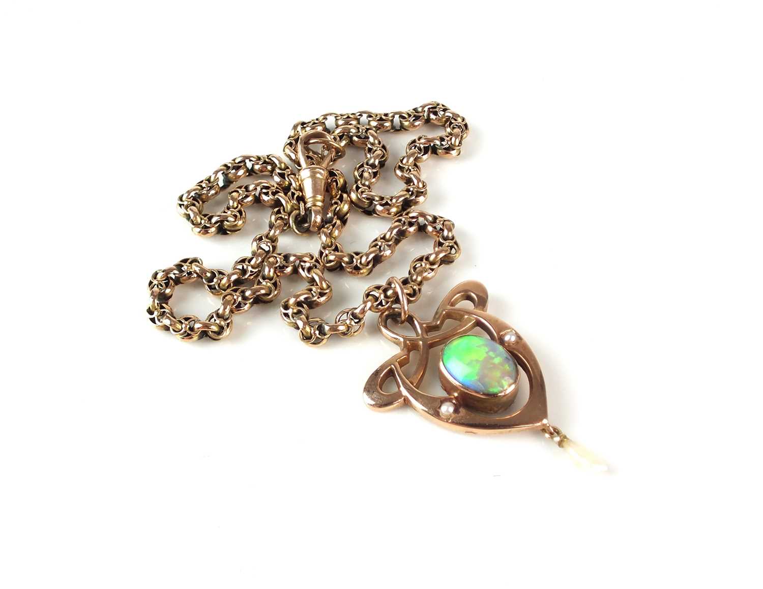 An Arts and Crafts opal pendant on chain