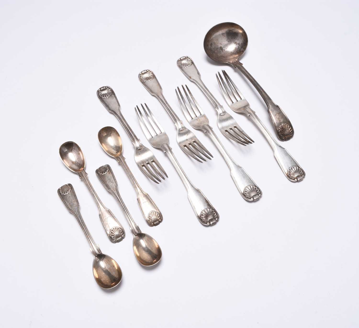 A collection of George III Irish Fiddle and Shell pattern silver flatware