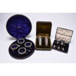 A cased set of four Edwardian silver salts and a cased pair of Victorian silver vases