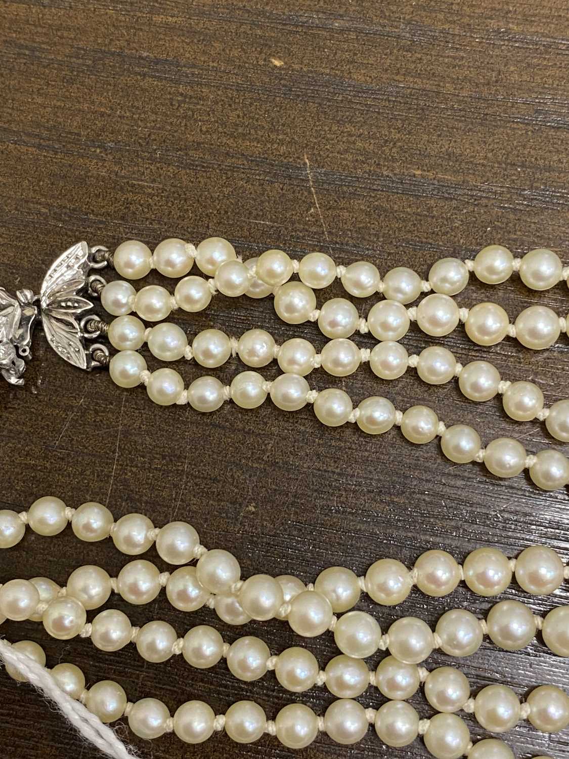 A four strand graduated cultured pearl necklace with 18ct white gold diamond set clasp - Image 11 of 16