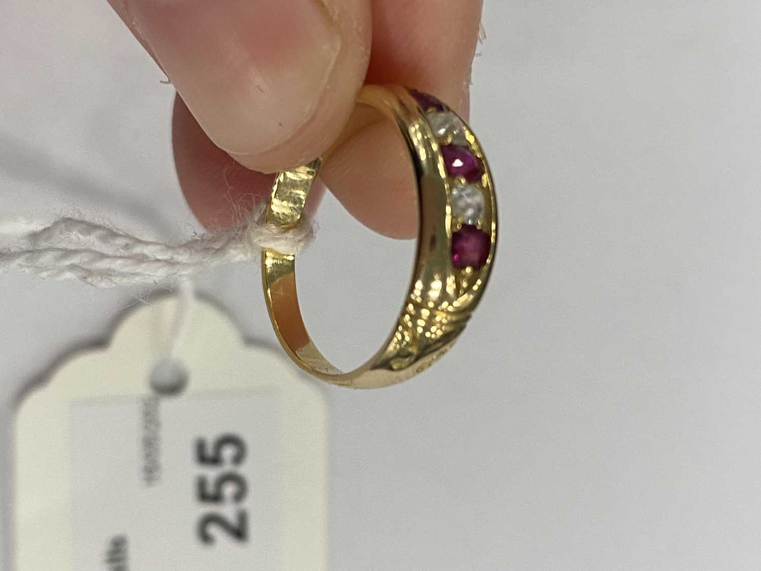 A graduated five stone diamond and untested ruby ring - Image 8 of 8