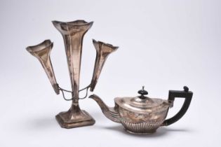 A silver teapot and silver epergne