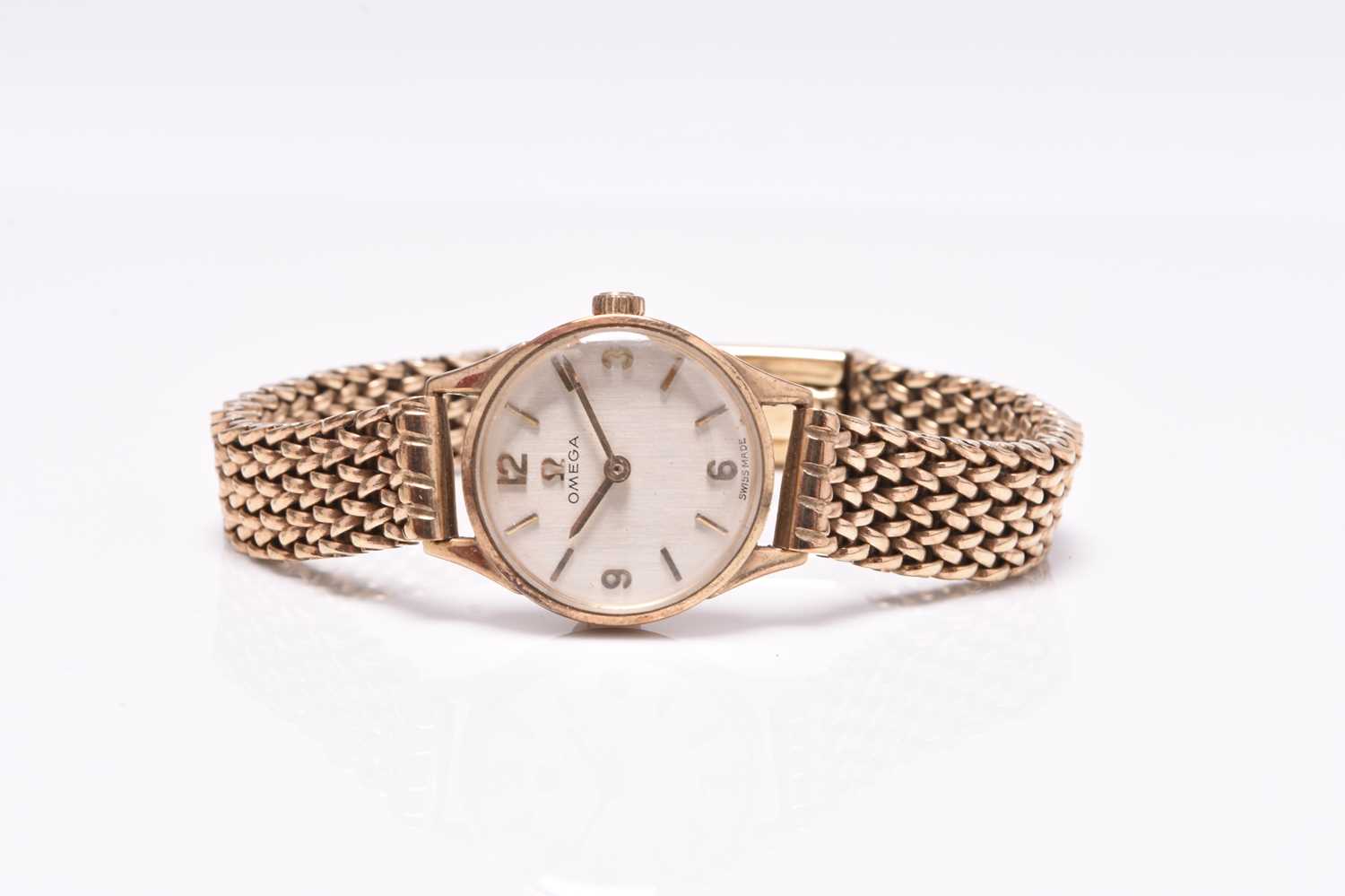 Omega: A lady's 9ct gold bracelet watch