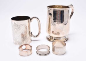Two silver mugs and three silver napkin rings