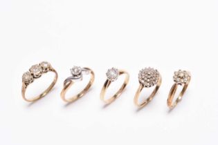 Five 9ct gold diamond set rings