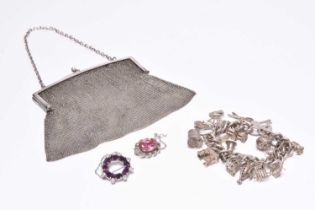 A silver mesh purse, together with a silver charm bracelet and two brooches