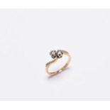 An 18ct gold two stone diamond crossover ring