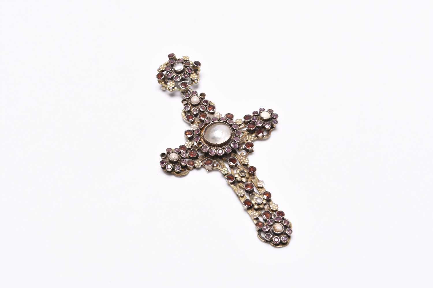 An Austro Hungarian blister pearl and garnet crucifix pendant