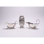 A silver sugar caster and a pair of sauce boats