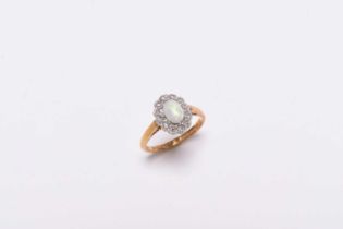 A Victorian style opal and diamond oval cluster ring