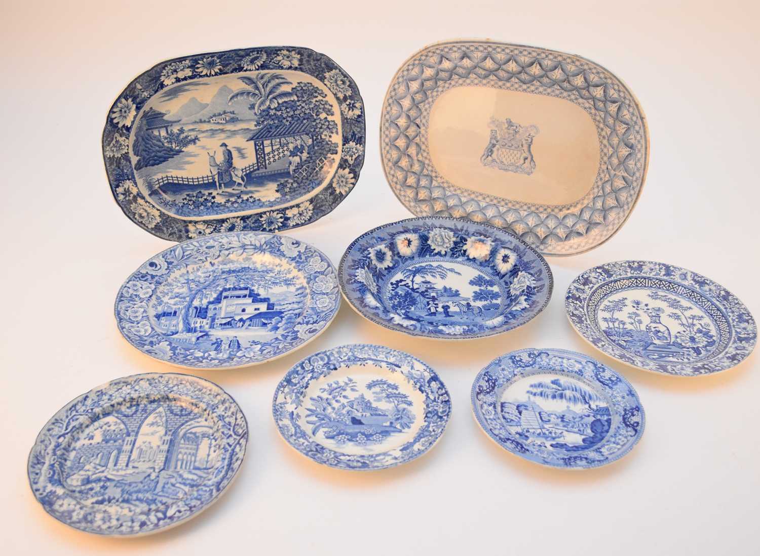 A collection of assorted English pottery plates and stands, early - mid 19th century