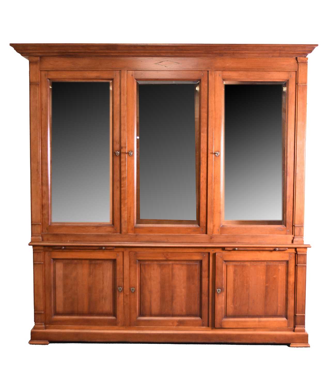 A reproduction mahogany glazed bookcase cabinet