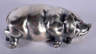 A CONTINENTAL SILVER AND RUBY FIGURE OF A PIG. 42.3 grams. 7 cm x 3.5 cm.