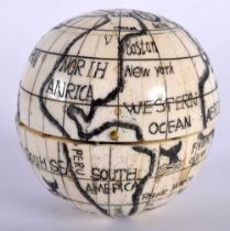 A Bone Globe with a Compass insert. 7cm x 7cm x 7cm