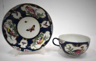 18th century Worcester teacup and saucer painted with a ‘Big Eyed Birds’ in mirror panels on a