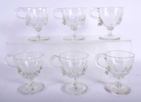 A SET OF SIX VICTORIAN GLASS CUSTARD CUPS. 8.5 cm high. (6)