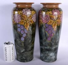 A LARGE PAIR OF ART DECO ROYAL DOULTON STONEWARE BERRY VASES. 35 cm high.