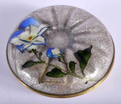 AN EARLY 20TH CENTURY CONTINENTAL ENAMEL BOX AND COVER decorative with flowers. 9 cm diameter.