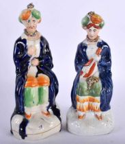 A PAIR OF 19TH CENTURY STAFFORDSHIRE FIGURES OF TURKS. 21 cm high.