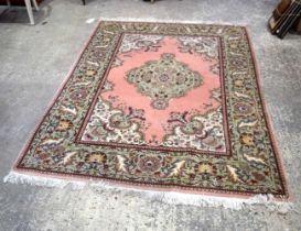 An Oriental rug 240 x 168 cm.