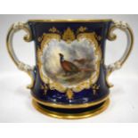 Royal Worcester two handled loving cup painted with a brace of pheasants in landscape in a raised