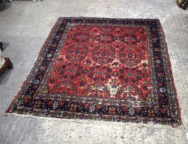 A Persian rug 194 x 165 cm.