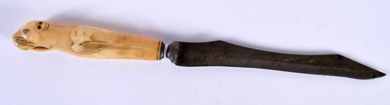 A LATE VICTORIAN MARINE BONE CARVED WALRUS KNIFE. 35 cm long.