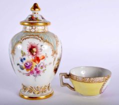 A 19TH CENTURY GERMAN BERLIN PORCELAIN VASE AND COVER together with a Meissen cup. Largest 12.5 cm