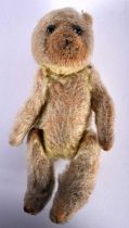 A SMALL VINTAGE TEDDY BEAR. 13 cm x 6 cm.
