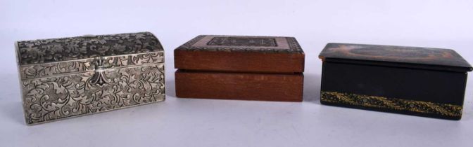 AN ANTIQUE RUSSIAN LACQUER BOX together with two others. Largest 13 cm x 7 cm. (3)