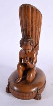 A FINE 18TH CENTURY CONTINENTAL CARVED FRUITWOOD SPILL VASE modelled as a nude male kneeling with