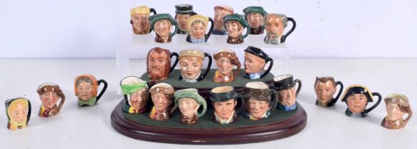 A collection of Miniature Royal Doulton Character jugs together with a stand (Qty)