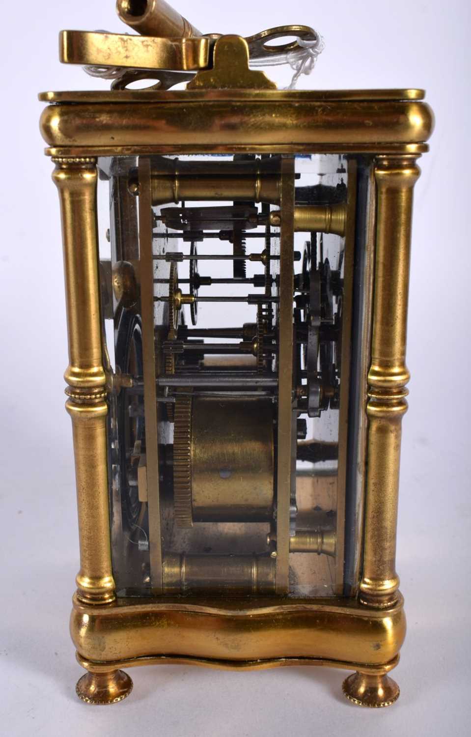 A CASED ANTIQUE BRASS CARRIAGE CLOCK. 14.5 cm high inc handle. - Image 5 of 7