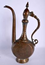 AN EARLY ISLAMIC MIDDLE EASTERN COPPER ALLOY EWER AND COVER decorative all over with figures and