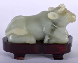 AN EARLY 20TH CENTURY CHINESE CARVED JADE FIGURE OF A BULLOCK Late Qing/Republic. 10 cm x 7 cm.