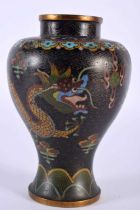 A 19TH CENTURY CHINESE CLOISONNE ENAMEL VASE Qing, decorative with dragons upon a black ground. 15cm
