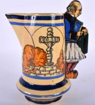 A RARE HENRIOT QUIMPER POTTERY JUG with figural handle, painted with landscapes. 20 cm x 12 cm.